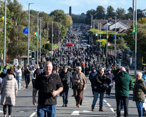 A large crowd walks down Garvaghy Road during a protest against an Orange Order parade