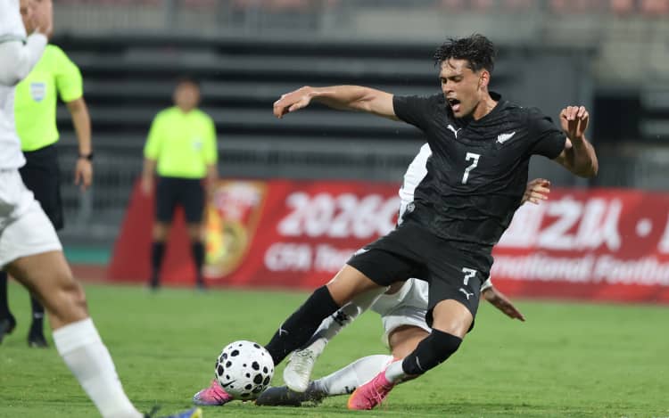 CHONGQING, CHINA - SEPTEMBER 24: Logan Rogerson of New Zealand in action against Palestine players during the CFA Team China International Football Competitions Chongqing 2026 match between New Zealand All Whites and Palestine at Tongliang Long Stadium on September 24, 2026 in Chongqing, China. (Photo by Hu Chengwei/Getty Images)