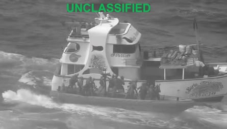 A still from a video of a bigger and smaller boat in water