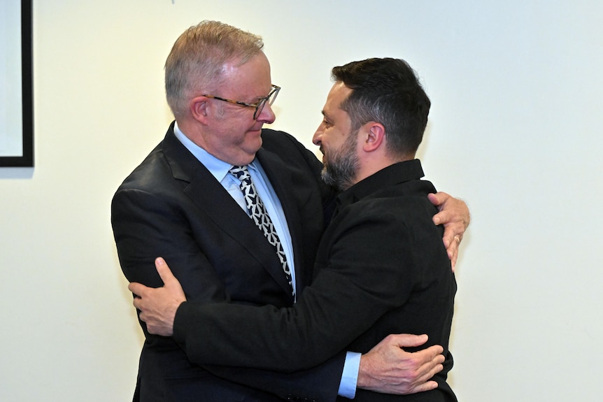Anthony Albanese and Volodymyr Zelenskyy hug.