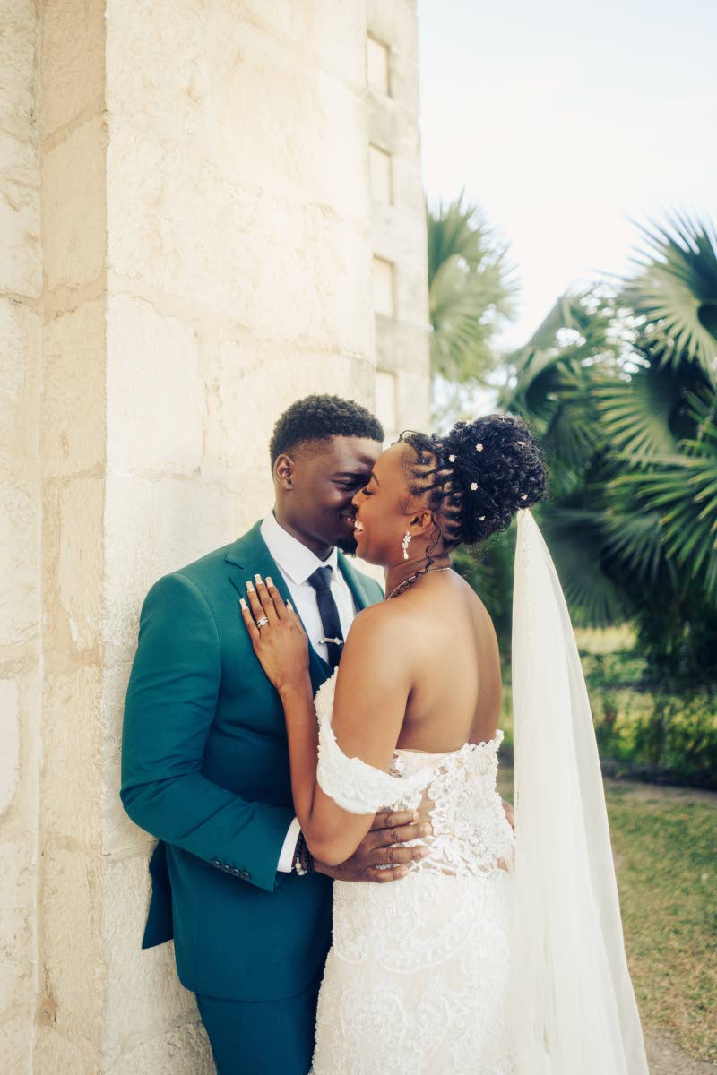 Sharing a warm embrace, the Rowes are all smiles as they celebrate the start of their new chapter as newly-weds.